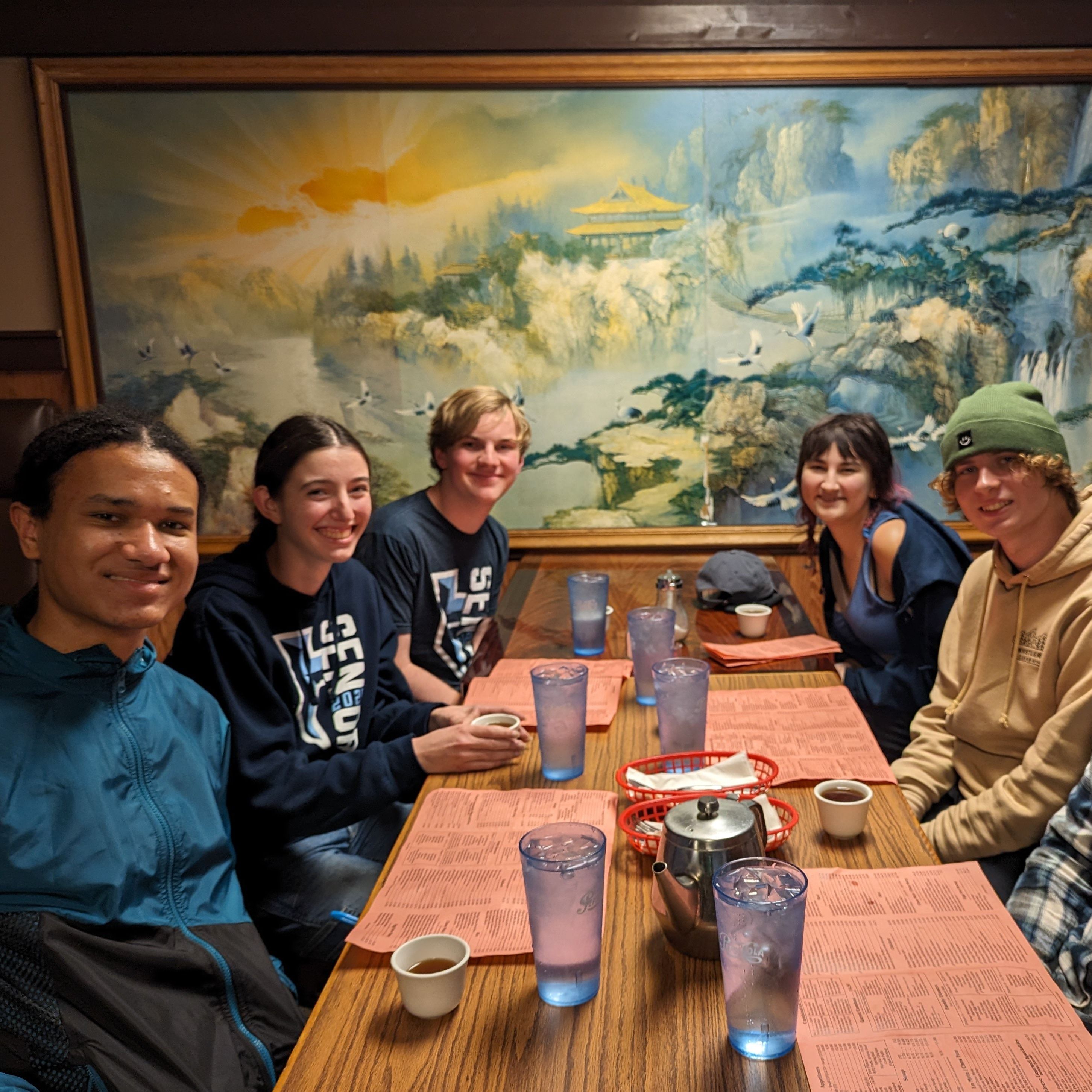 Isaiah and friends eating Chinese food