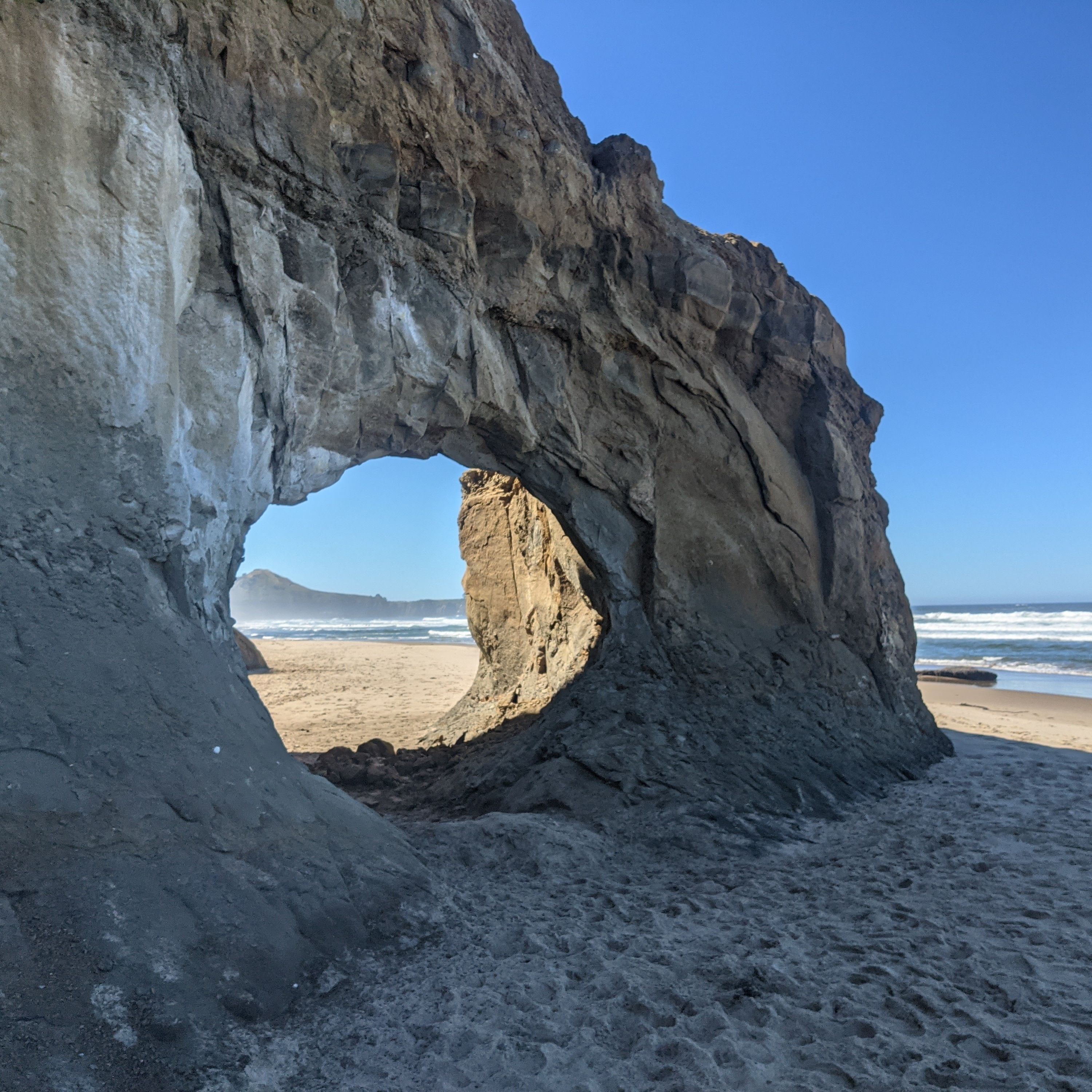 A circular rock formation on the Oregon beach